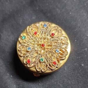 Elegant Gold Brooch with Multicolor Accents